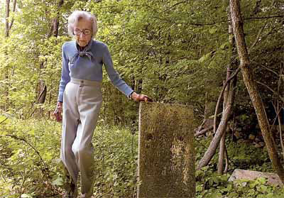 Peggy Bunnell walks through the old Biddle family cemetery on East Middle Patent Road in Stamford