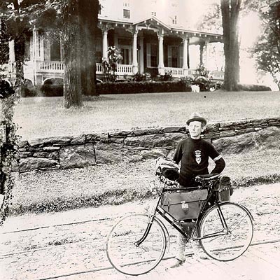 probably Bradford Wardwell in front of the house, street railroad tracks can be seen