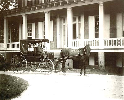 the Wardwell family in a horse carriage, 1900