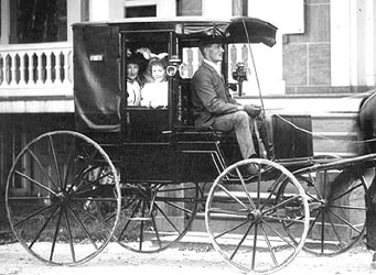 the family in their horse carriage