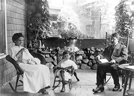 Dr. Nemoitin with wife & son on patio